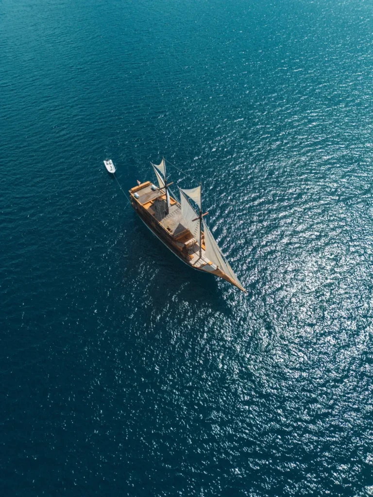 KAI Voyage 33 metre phinisi photographed on the water off Labuan Bajo