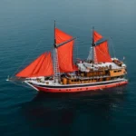 The La Galigo phinisi liveaboard anchored in Raja Ampat