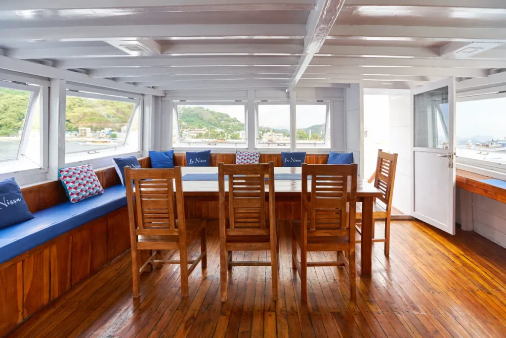 Indoor dining area aboard La Nissa phinisi