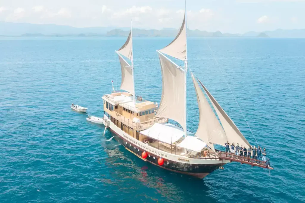 Aerial view of Lamborajo 2 with sails set in Komodo National Park