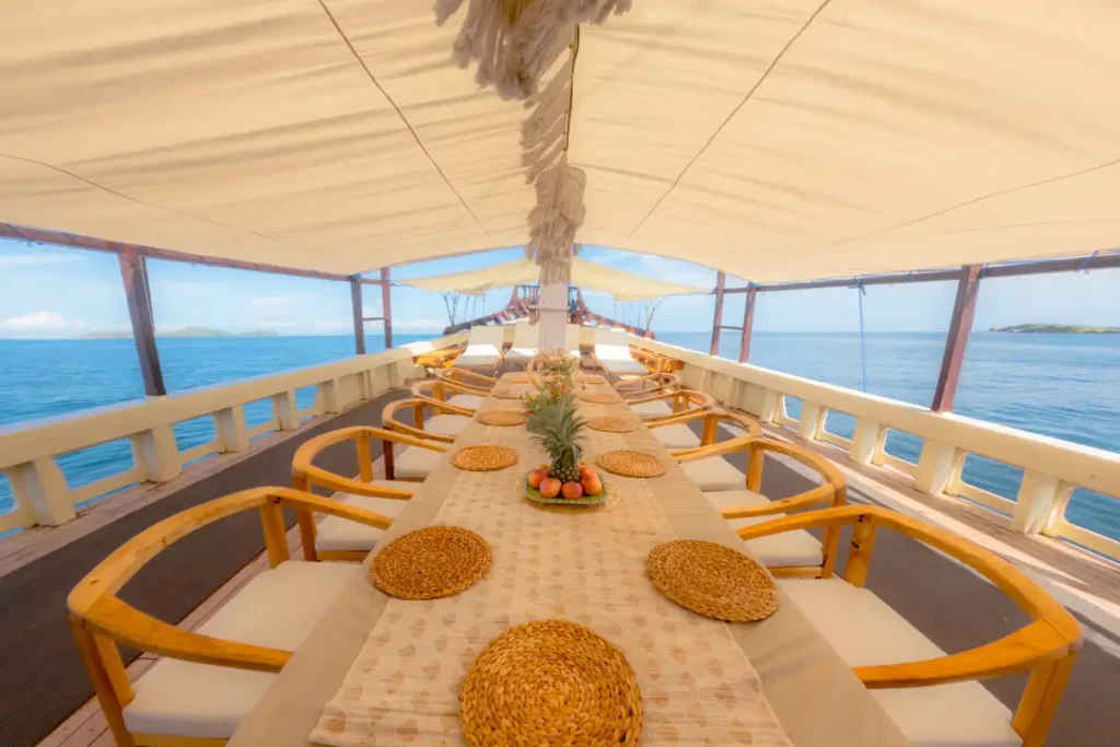 Outdoor dining table set on the shaded deck of Lamborajo 2