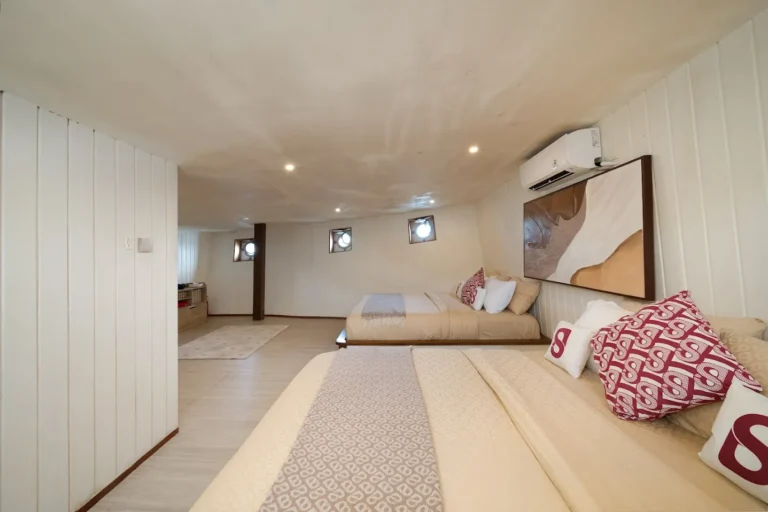 Two queen beds in the Portofino cabin aboard Le Costa
