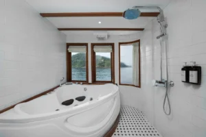 Private jacuzzi in the Santorini master cabin aboard Le Costa