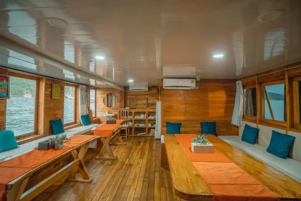 Indoor dining and lounge aboard Maipa Deapati