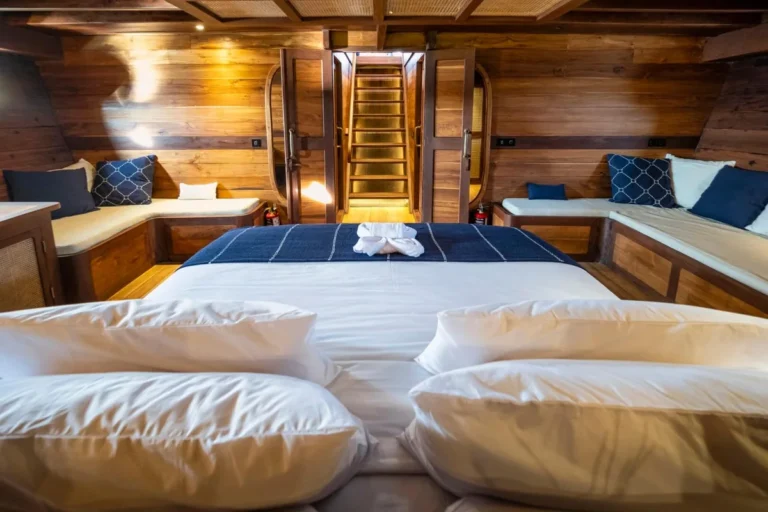 King bed and sofa in the Master Cabin aboard Majik
