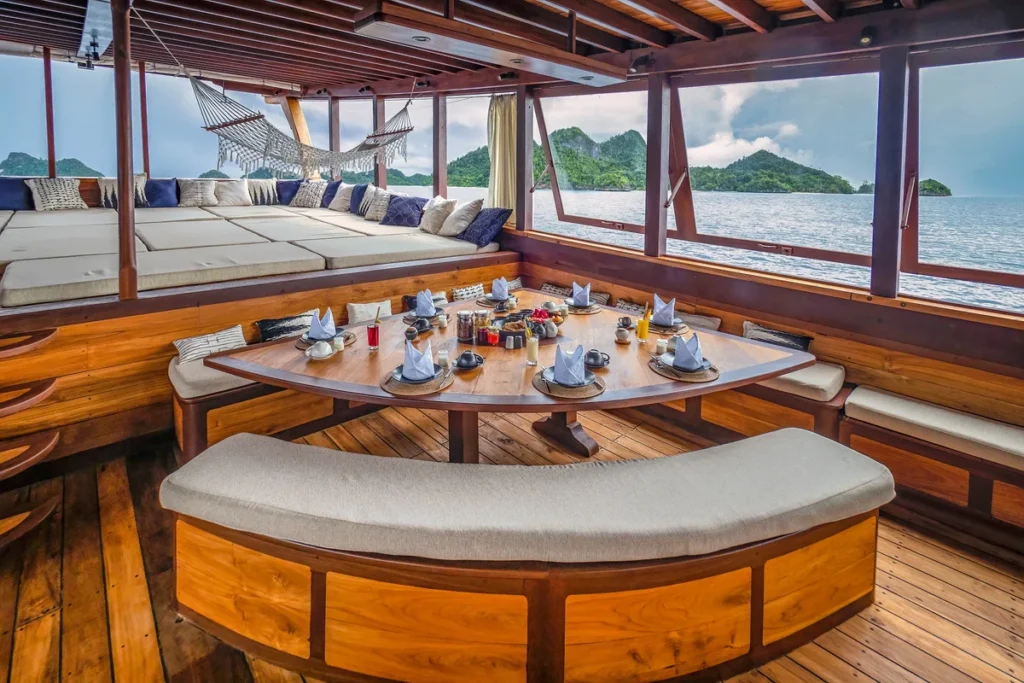 Round dining and lounge area aboard Majik