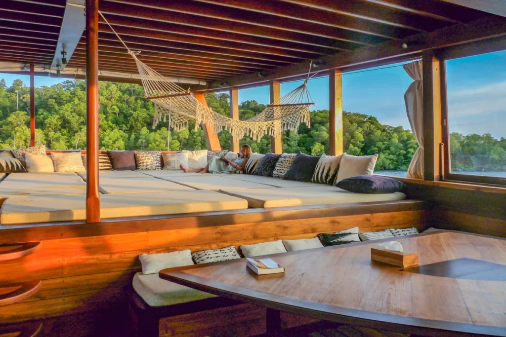 Upholstered guest lounge aboard Majik