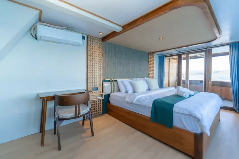 Interior of a Marea signature cabin with double bed and ensuite bathroom