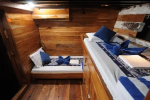 Storage space in a twin cabin aboard Moana Cruising