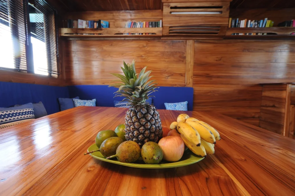 Indoor dining table in the salon of Moana Cruising