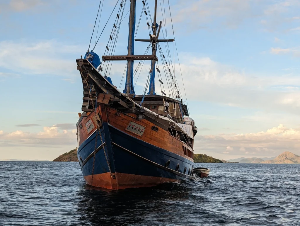 The Moana phinisi schooner seen from the water in Komodo