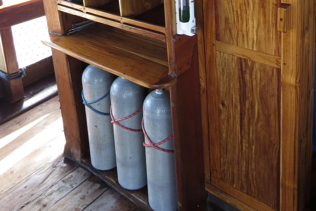 Tanks racked on the dive deck of Moana Cruising