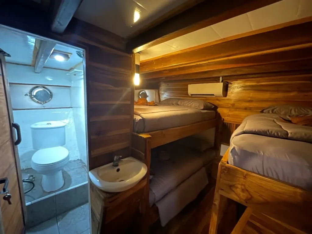 Sharing Room with double bed and single bunks aboard Natural Phinisi