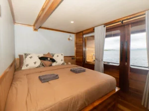 Azure cabin queen bed aboard Naturalia Cruise