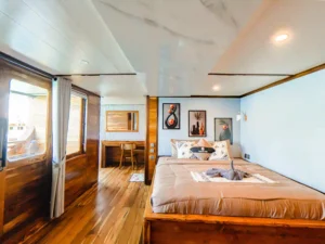 Sandal cabin king bed aboard Naturalia Cruise
