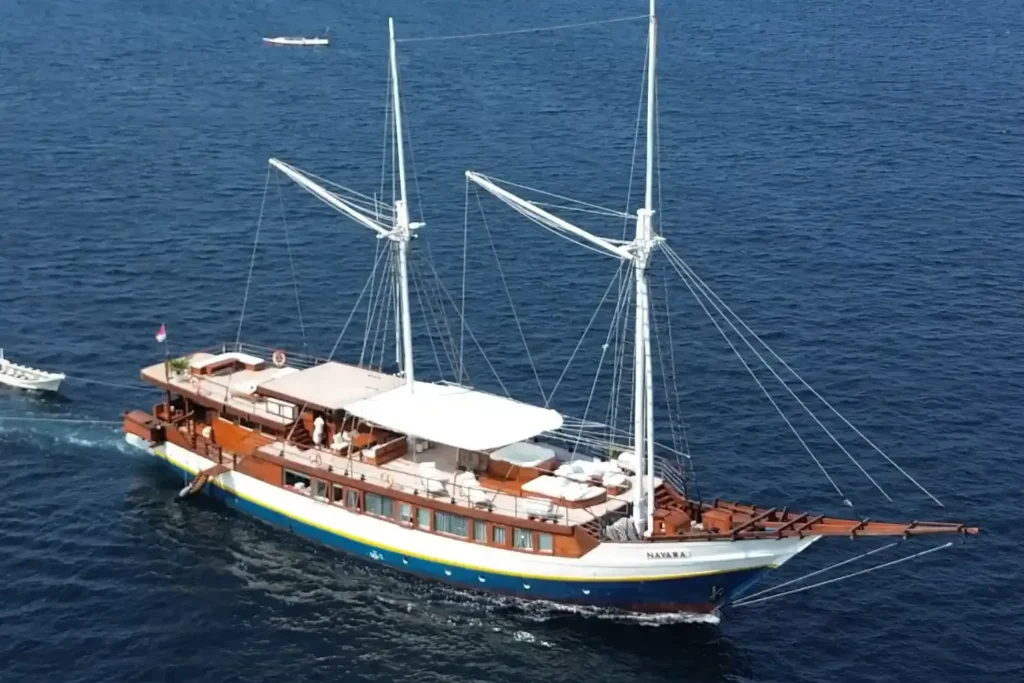 Aerial view of the Nayara Cruise phinisi with its twin masts under way at sea