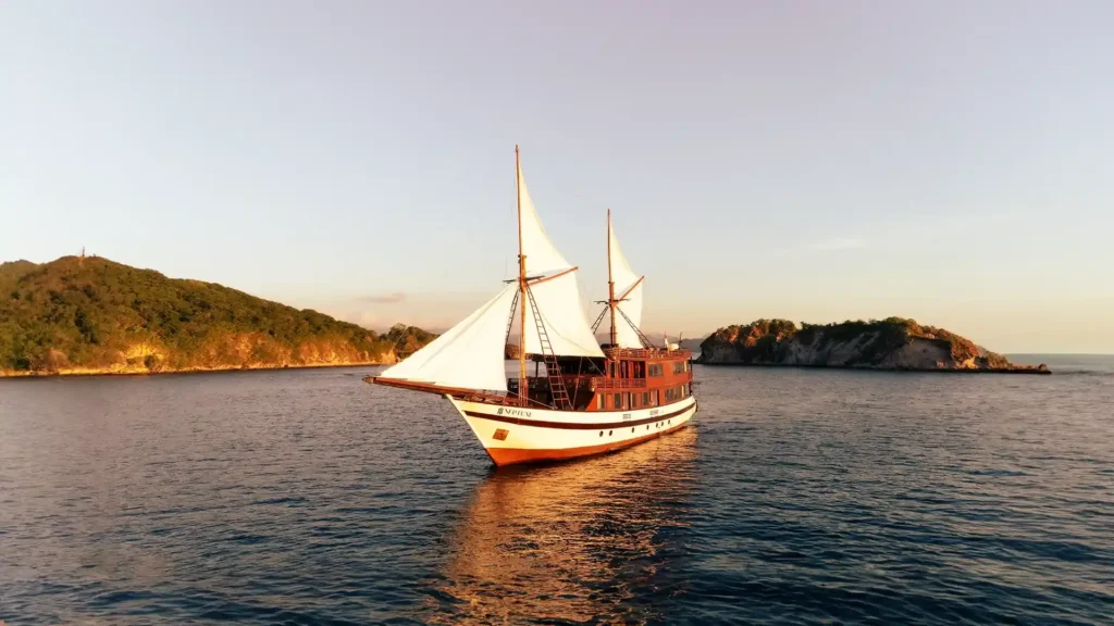 Neptune Cruise, a 40-metre Buginese schooner, under way in Komodo National Park