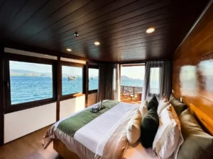 Mansard I cabin aboard Neptune Cruise with queen bed and panoramic windows