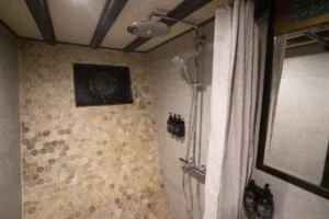 Second private bathroom in a lower-deck double cabin aboard Nusa Kembara