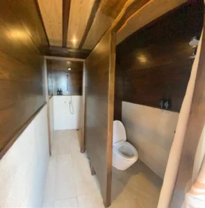 Private bathroom serving the second twin cabin aboard Nusa Kembara