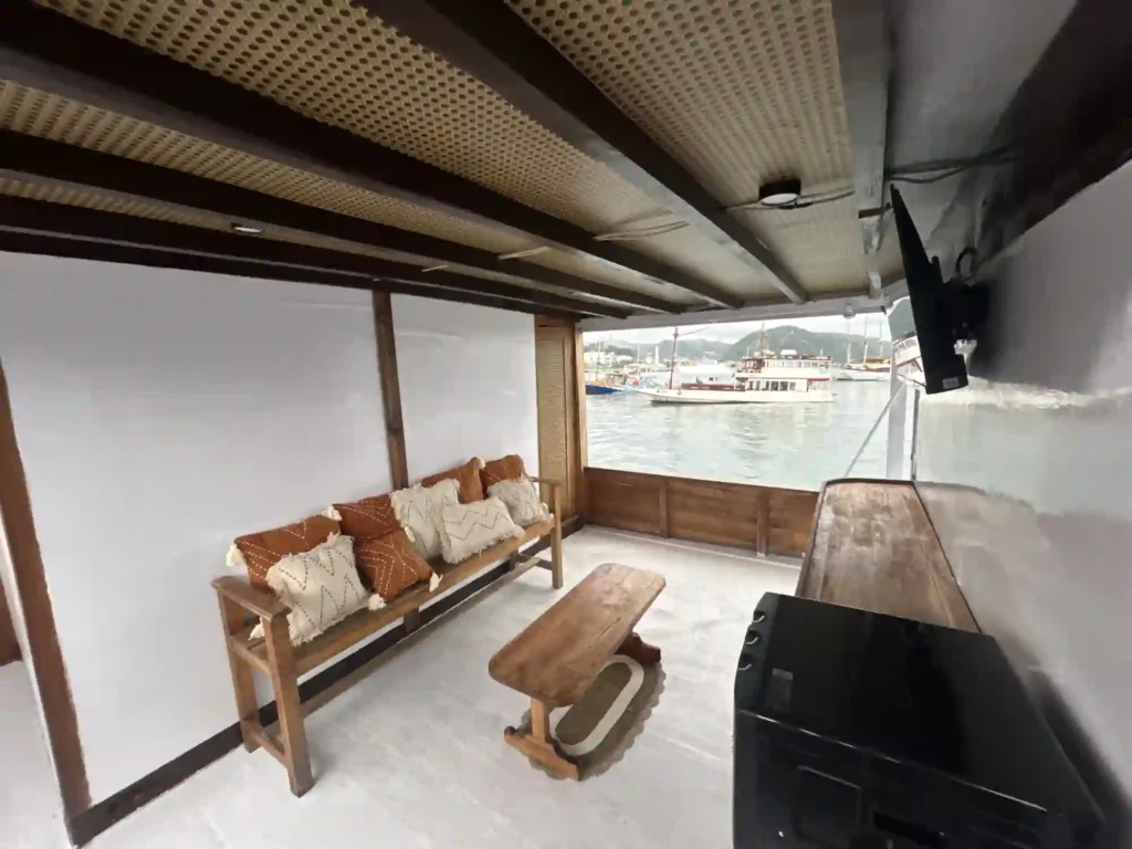 Outdoor relaxation area aboard Nusantara Karya phinisi