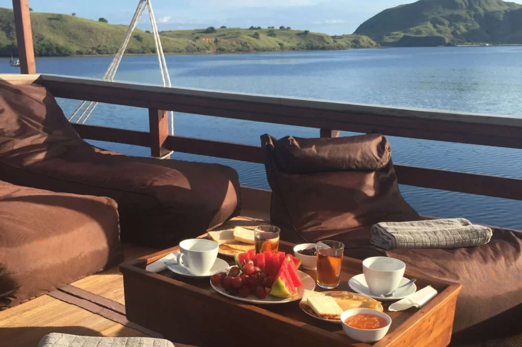 Open-deck dining and lounge seating aboard Nyaman