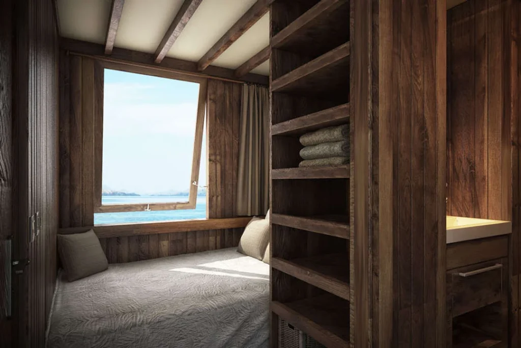 Main deck double cabin with a sea-facing window aboard Nyaman