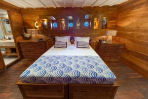 Second double-bed guest suite with portholes aboard Ocean Pure 1
