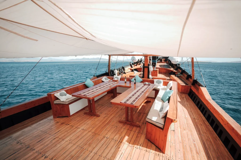 Main deck lounge and dining table aboard Queenesia II