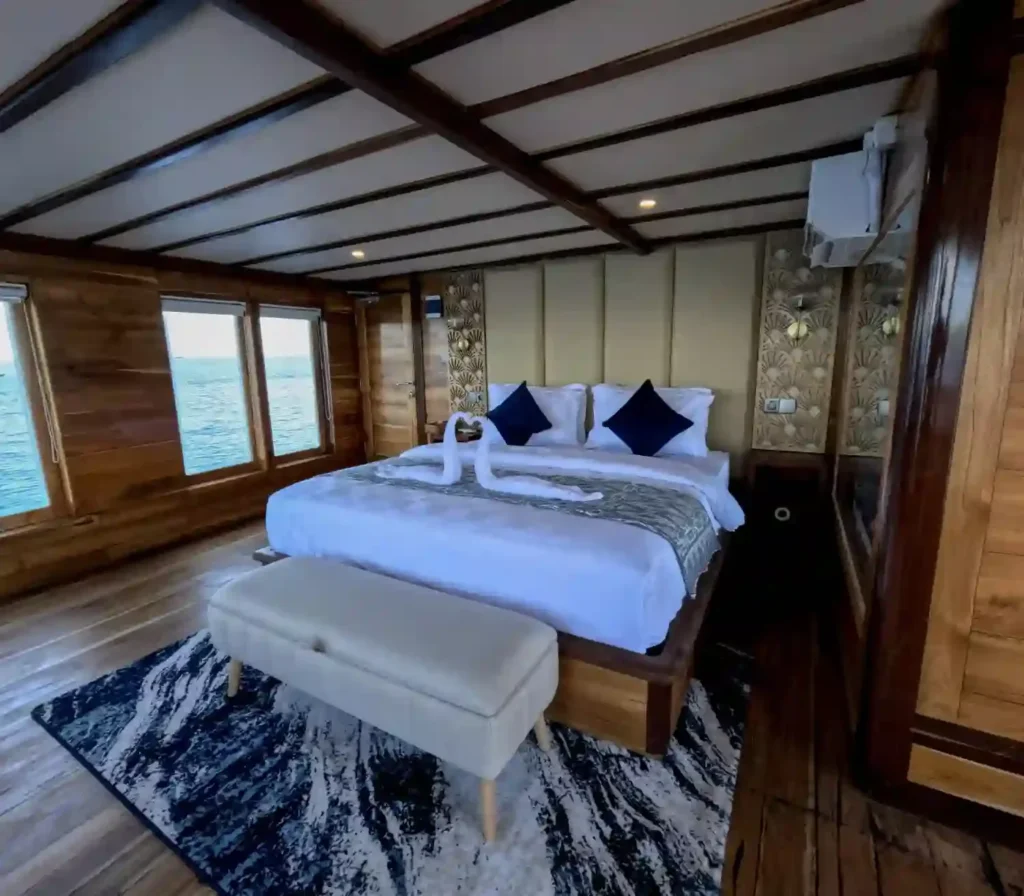 Malacca 1 upper-deck cabin on Raffles Cruise with a queen bed, the top grade on board