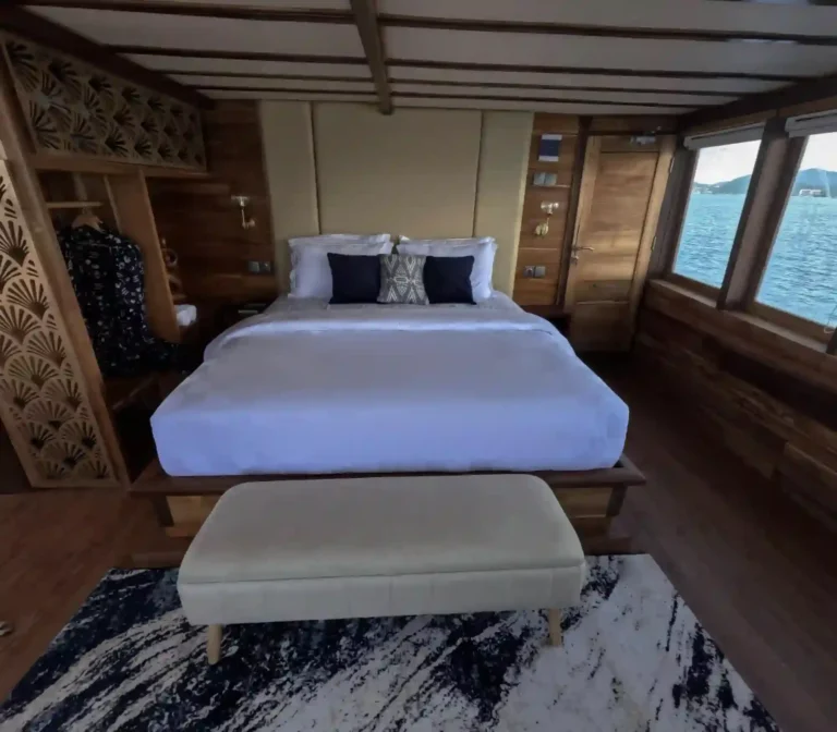 Malacca 2 main-deck cabin on Raffles Cruise with a queen bed and private balcony