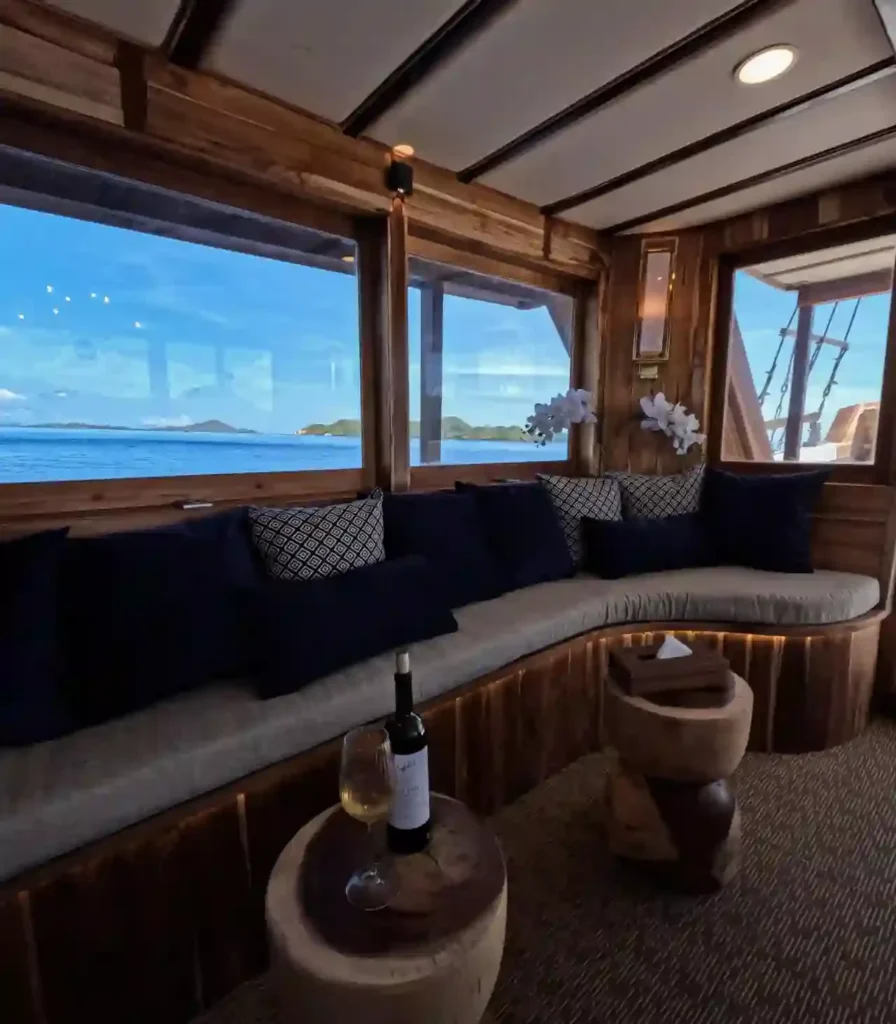 Outdoor dining area on Raffles Cruise, set for meals with open sea views