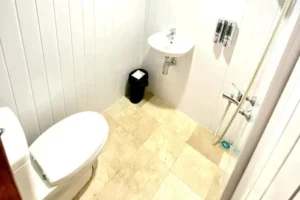 Main-deck Deluxe Cabin ensuite bathroom aboard Revfiero phinisi