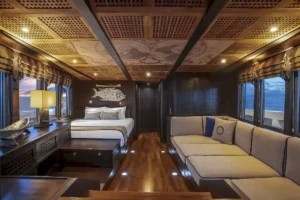 Owner Manta Suite living space and bed aboard Scubaspa Zen