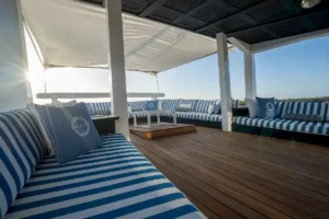 Private overwater lounge of the Owner Manta Suite aboard Scubaspa Zen