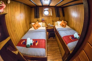 Wide view of a lower deck twin cabin aboard Sea Safari 8