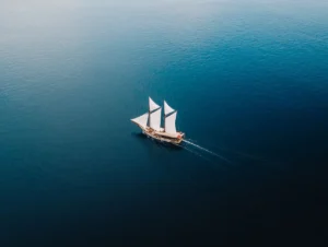 Aerial view of Senja sailing across open blue sea