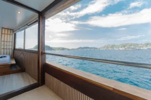 Signature private cabin aboard Sora phinisi with double bed and ensuite bathroom