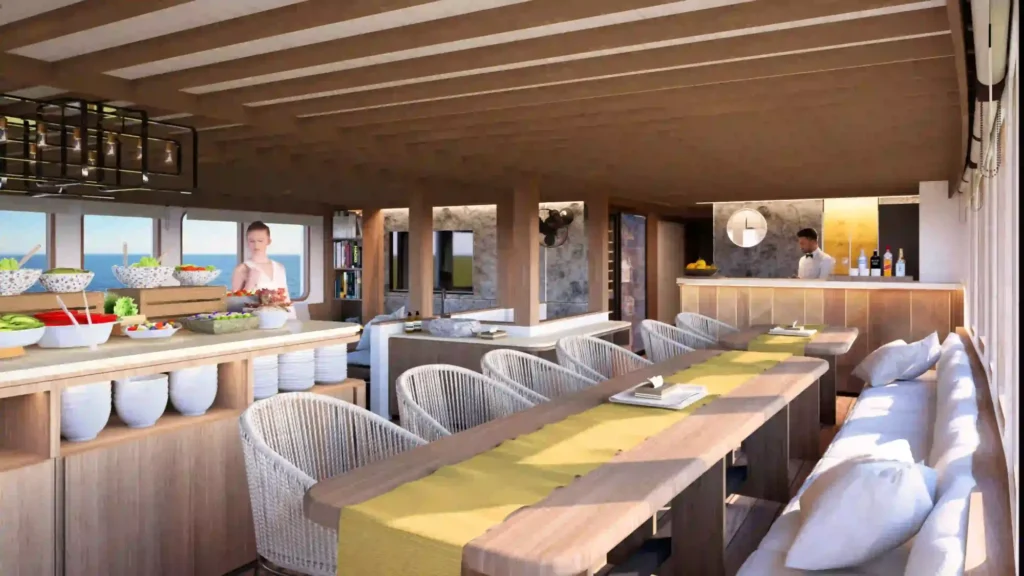 Long indoor dining table on Sukha Sail 2 set for the full guest complement