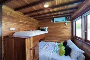 Sundari deluxe balcony shared cabin aboard Sundari Voyages phinisi