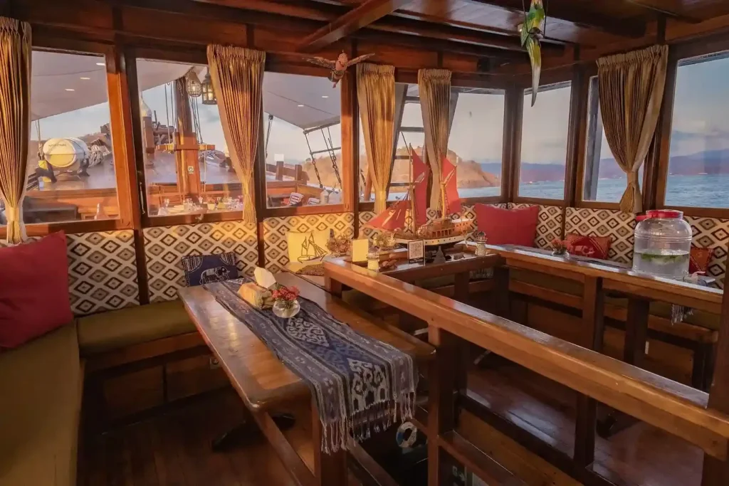 Indoor dining area aboard Supraba phinisi