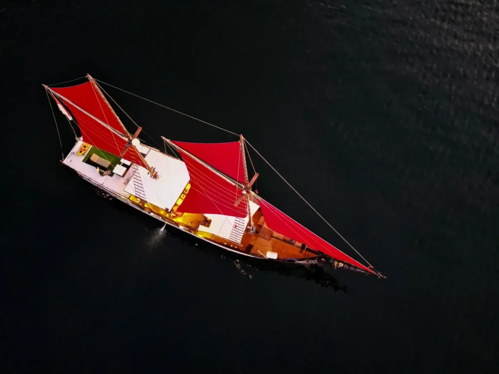 Supraba phinisi exterior showing the traditional wooden hull and rigging