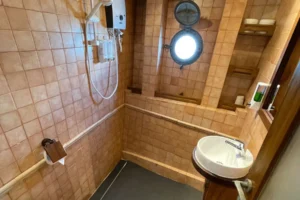 Large en-suite bathroom in a guest suite aboard Tambora
