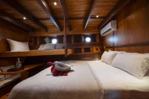 Ta’Talasa Asmat Cabin queen bed and air conditioning