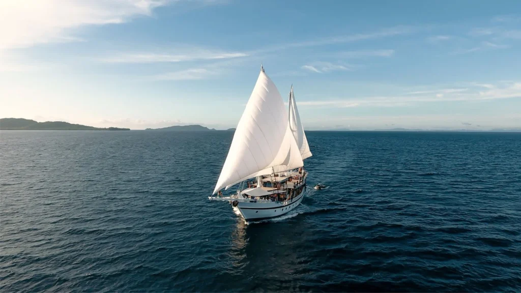 Teman liveaboard sailing under canvas