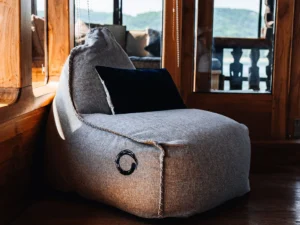 Private lounge chair by the panoramic windows in The Oracle First Suite