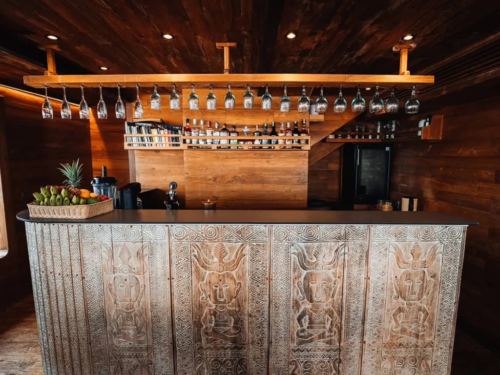 Hand-carved wooden bar aboard The Oracle yacht