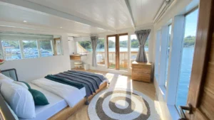 Master Cabin with double bed and ocean-view windows aboard Zada Ulla