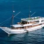 Aerial view of Zada Ulla phinisi underway near Komodo National Park