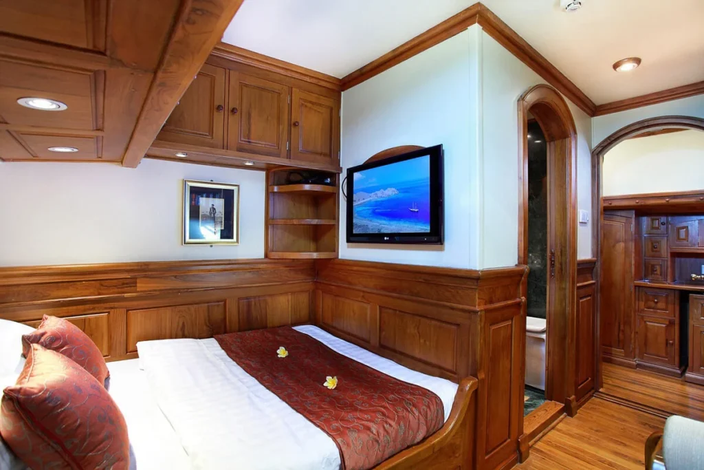 Bed and teak interior in Adelaar Staterooms two and three
